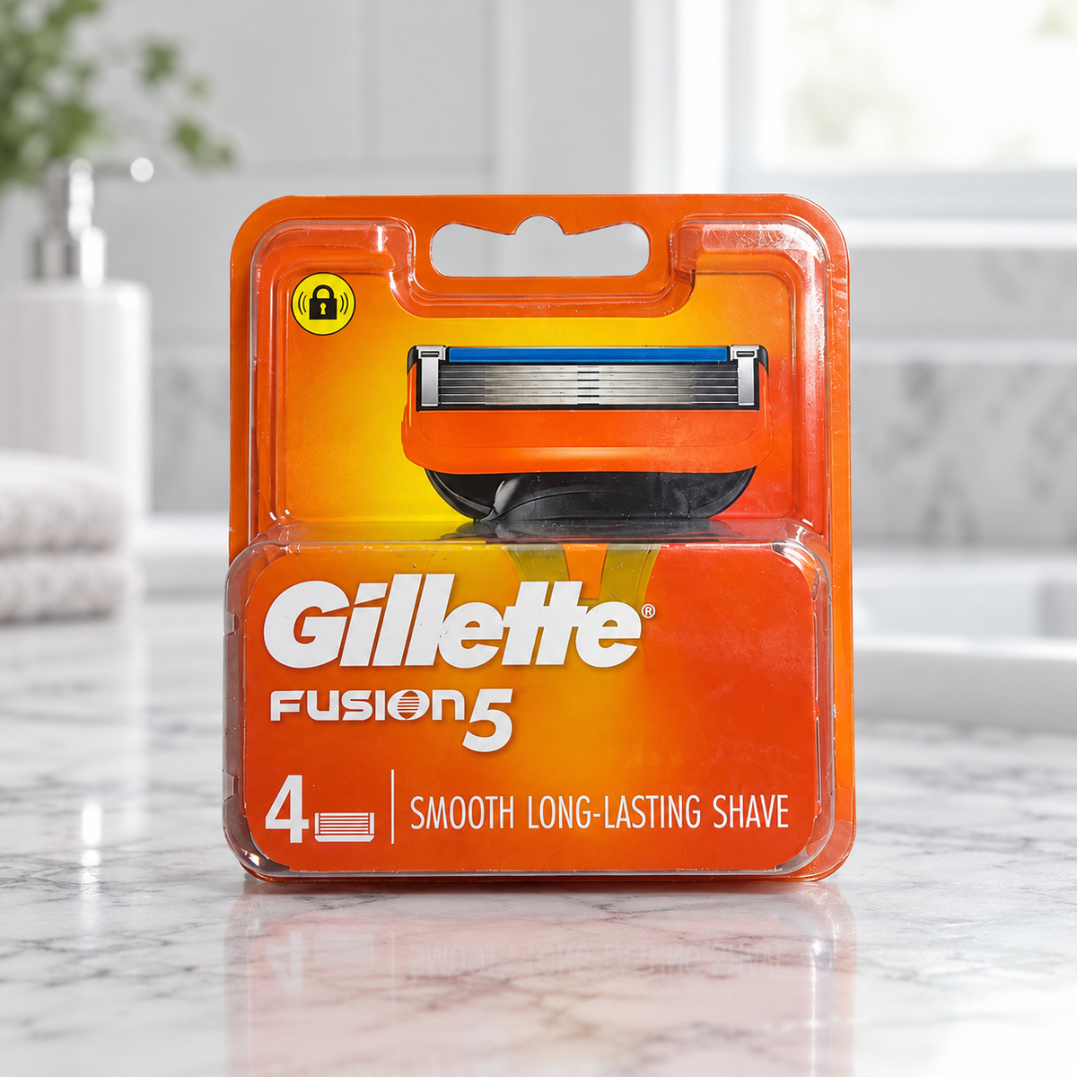 Gillette Fusion5 four-count old-design refill pack on a bathroom countertop