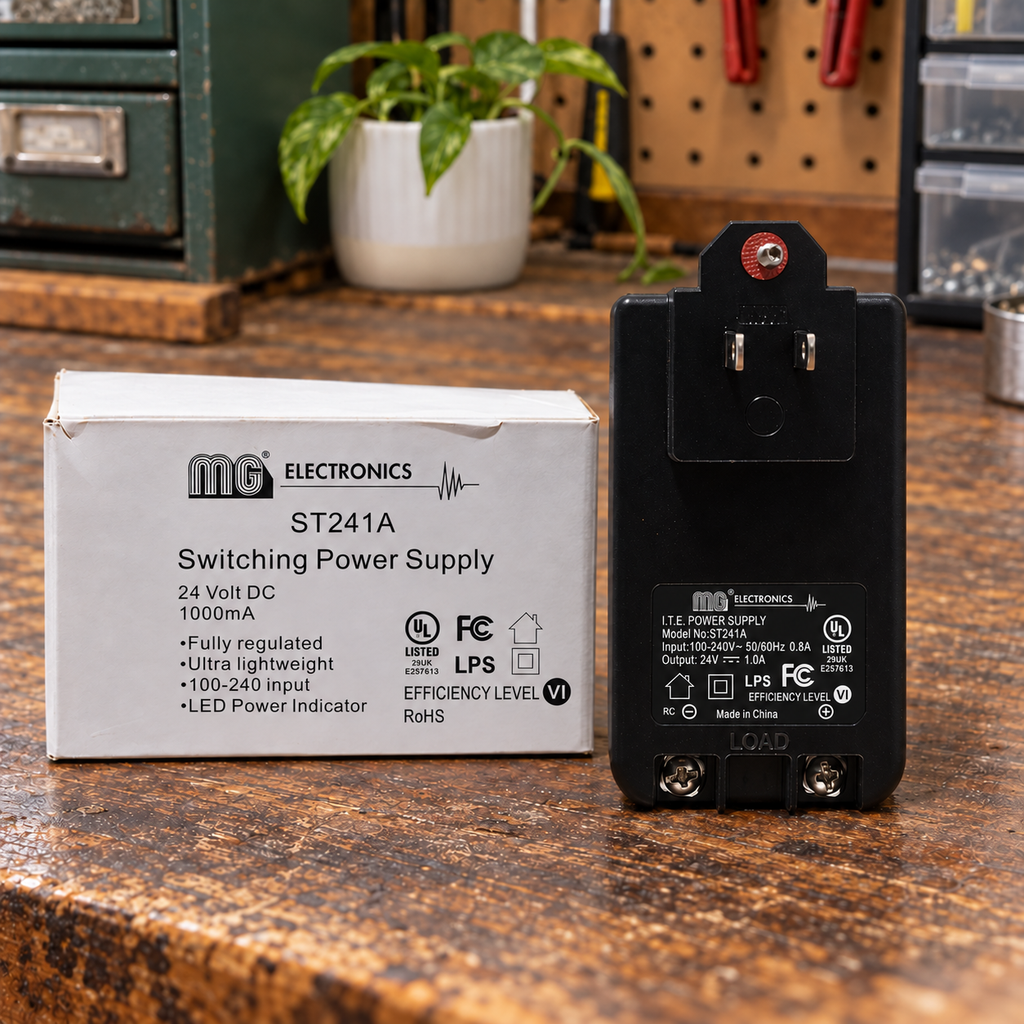 AI-generated lifestyle illustration of the unplugged MG ST241A power supply and original box in an indoor workshop setting.