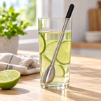 AI-generated lifestyle illustration of one Undici chiller swizzle stick in a clear lime drink on a sunny kitchen table.