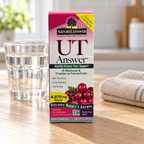 Nature's Answer UT Answer D-Mannose & Cranberry Liquid, 4 fl oz on an oak kitchen table with water and linen. Props not included.
