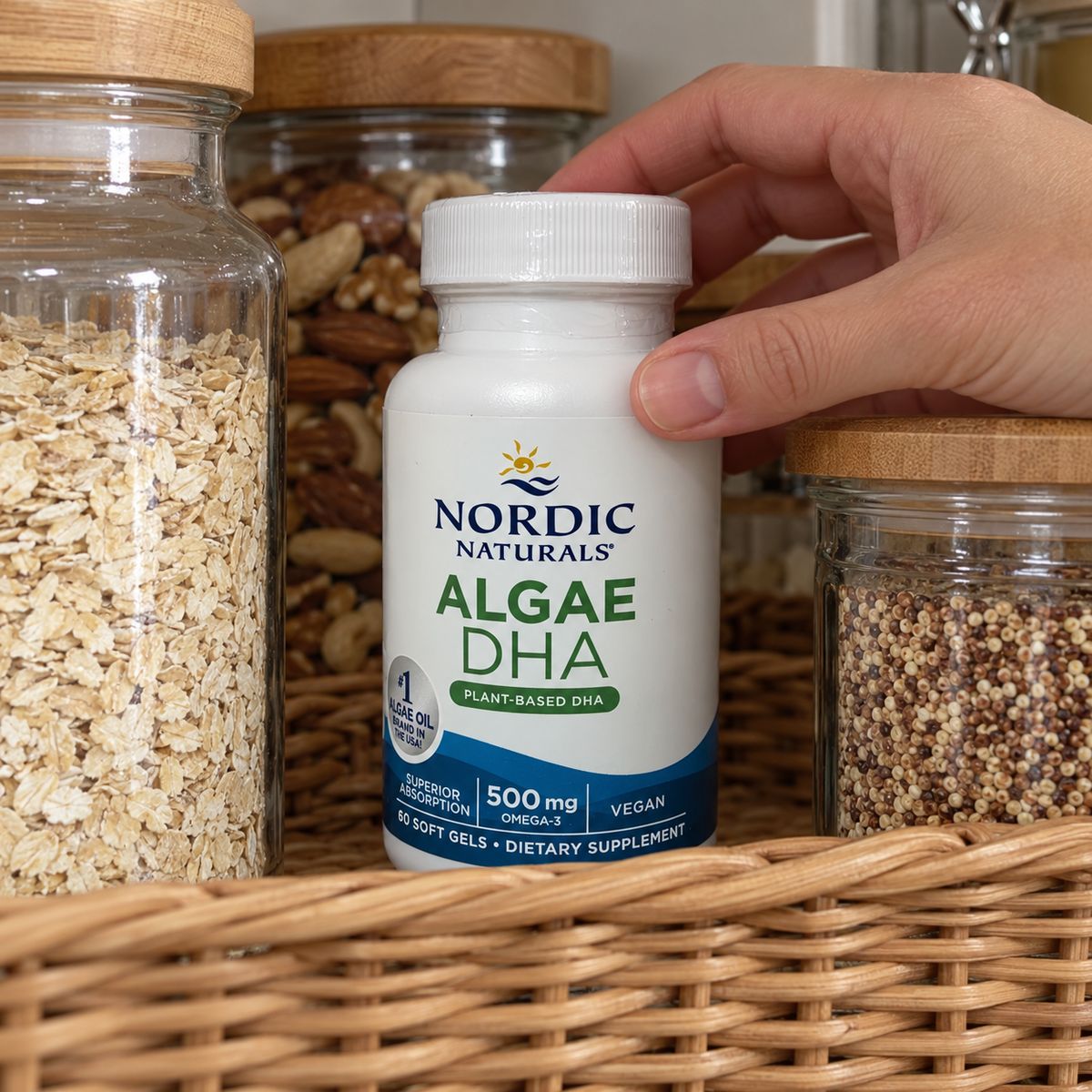 Nordic Naturals Algae DHA bottle being placed in a woven pantry organizer