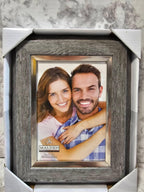 Framed photograph of a couple with 'Malden' branding on a marble surface