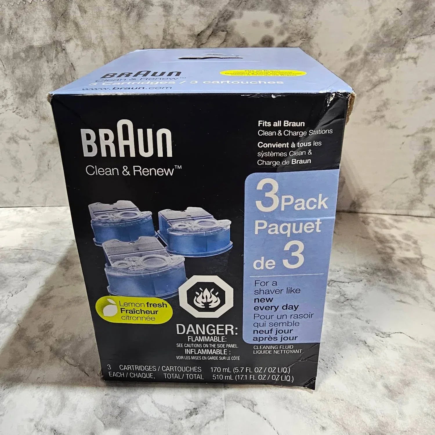 Braun Clean & Renew 3-pack cartridge box on a marble surface