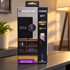 Monster purple LED HDMI cable package on a softly lit media-room shelf