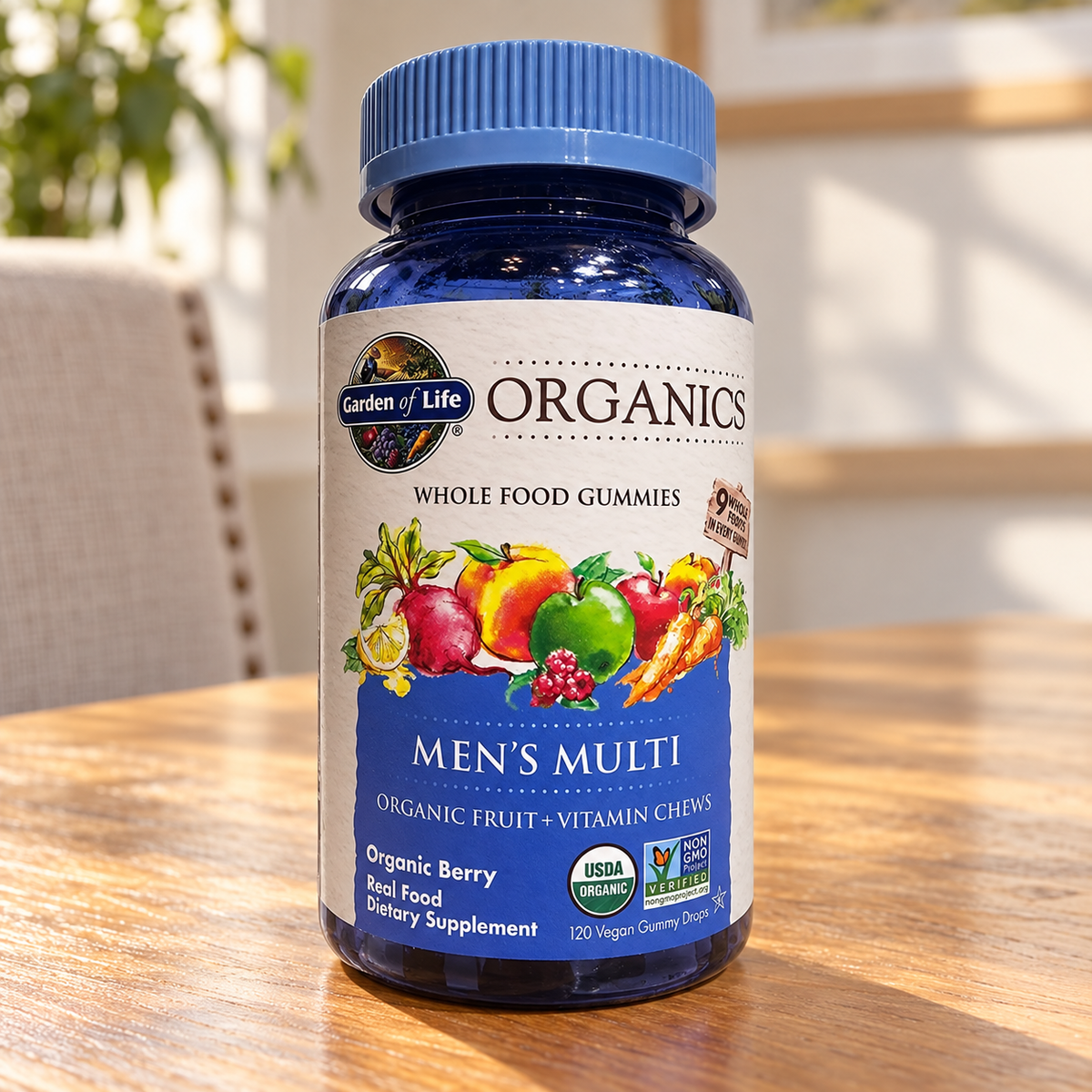 Garden of Life Organics Men's Multi gummy bottle on a sunlit dining table