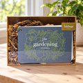 Inklings Paperie Gardening Journal kit box on a bright indoor planning table