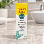 Burt's Bees Skin Balancing Gel Cream carton on a pale stone bathroom vanity