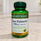 Nature's Bounty Saw Palmetto 450 mg bottle on a pale stone kitchen counter