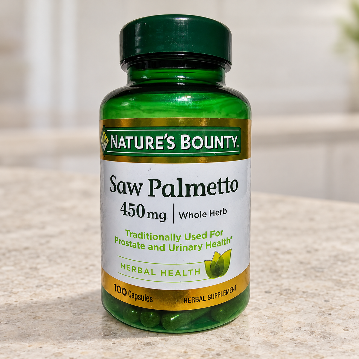 Nature's Bounty Saw Palmetto 450 mg bottle on a pale stone kitchen counter