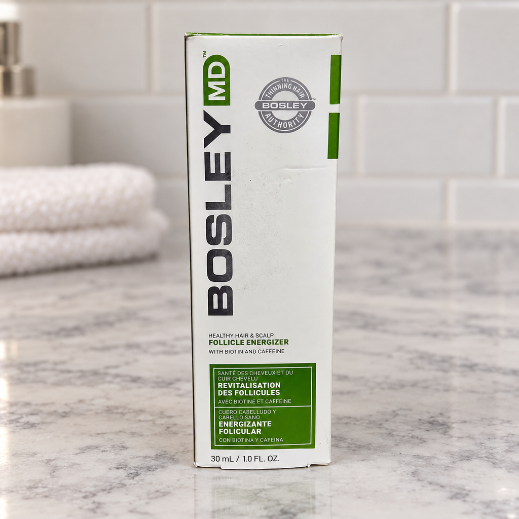 BosleyMD Follicle Energizer carton on a pale stone vanity beside folded towels