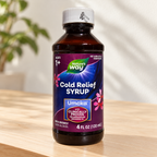 Nature's Way Umcka Cold Relief Syrup 4 fl oz bottle on a pale maple sideboard