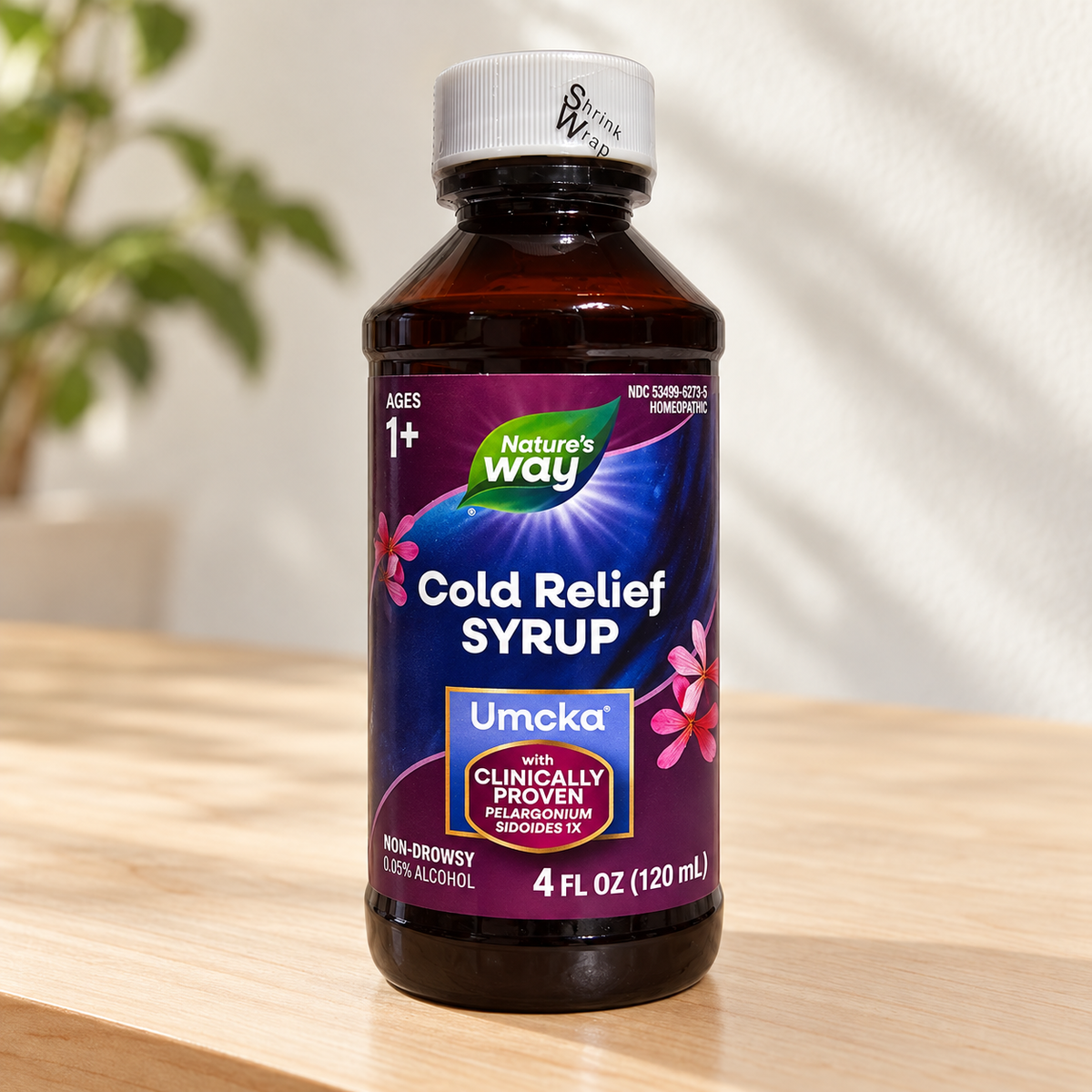 Nature's Way Umcka Cold Relief Syrup 4 fl oz bottle on a pale maple sideboard