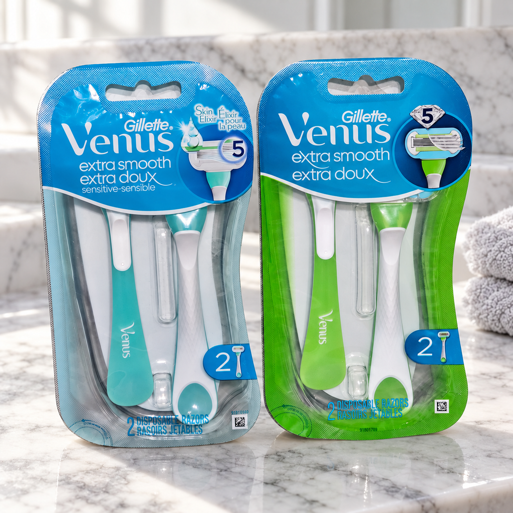Venus Extra Smooth and Extra Smooth Sensitive two-razor packs on a marble bathroom counter