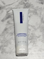 Tube of ZO Medical Foamacleanse Gentle Foaming Cleanser on a marble background