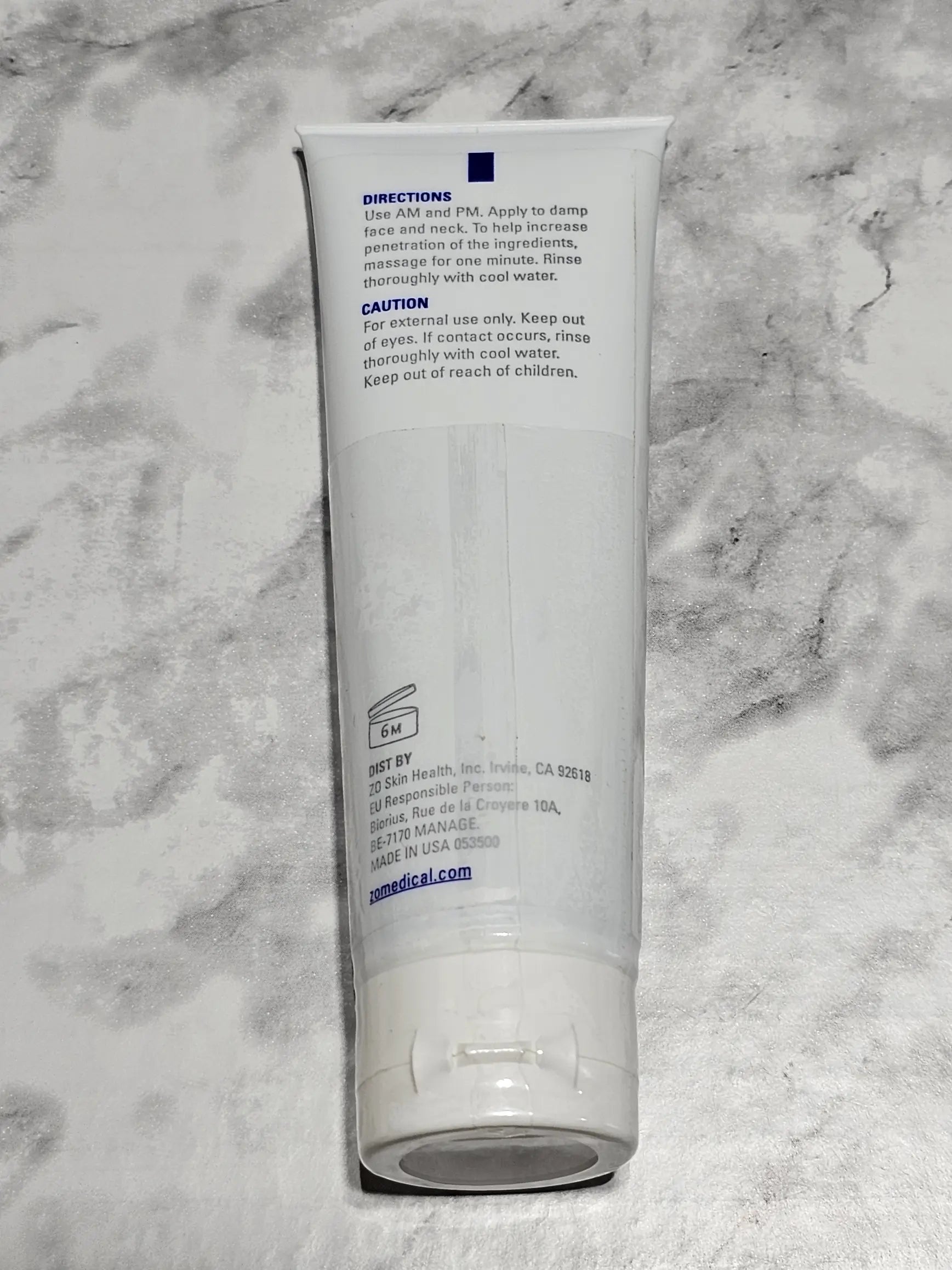 Tube of cream on a marble surface