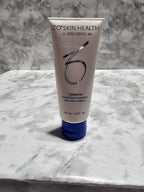 Tube of ZO Skin Health cream on a marble surface