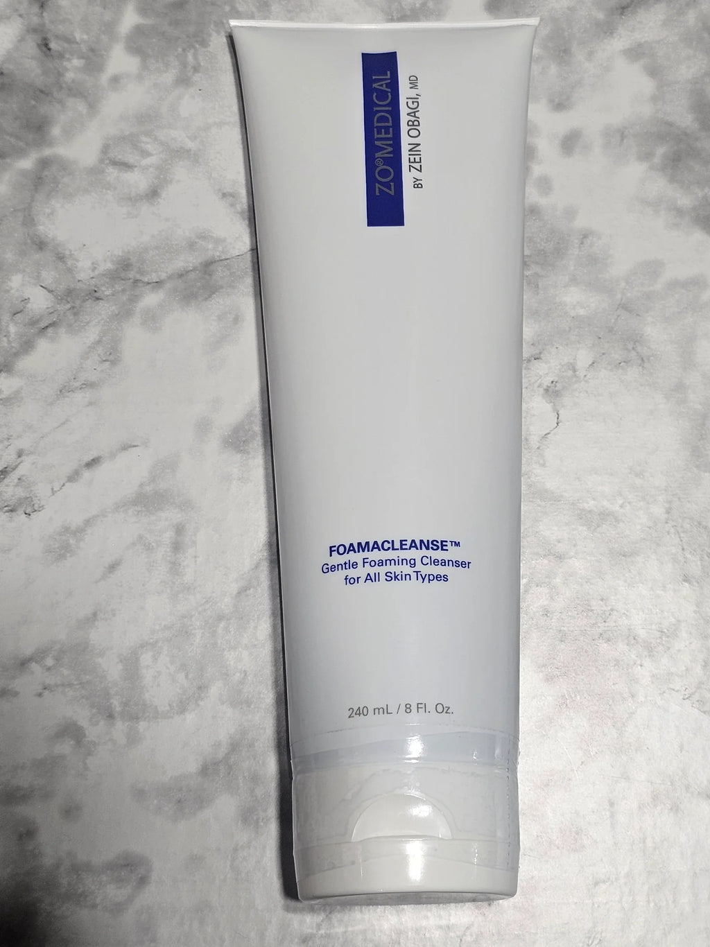 Tube of ZO Skin Health face wash on a marble surface