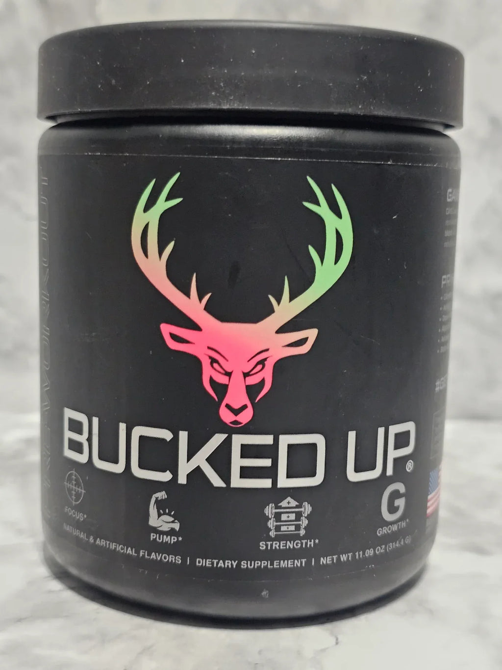 Black container with 'Bucked Up' logo on a gray background