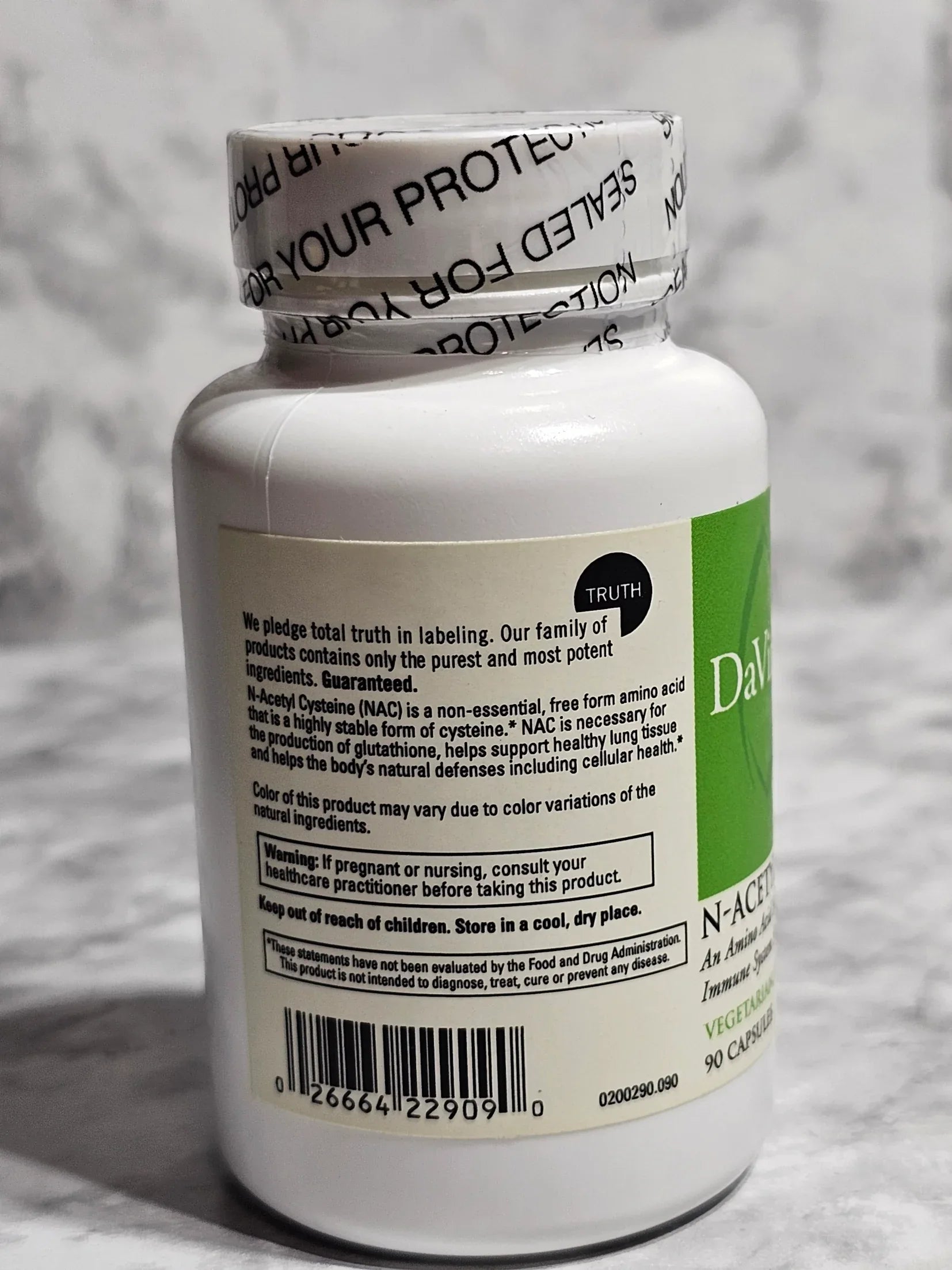 Supplement bottle with label on a gray background