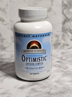 Optimistic supplement bottle on a marble surface