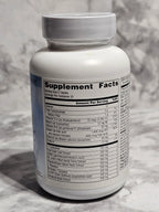 Supplement bottle with label on a marble surface