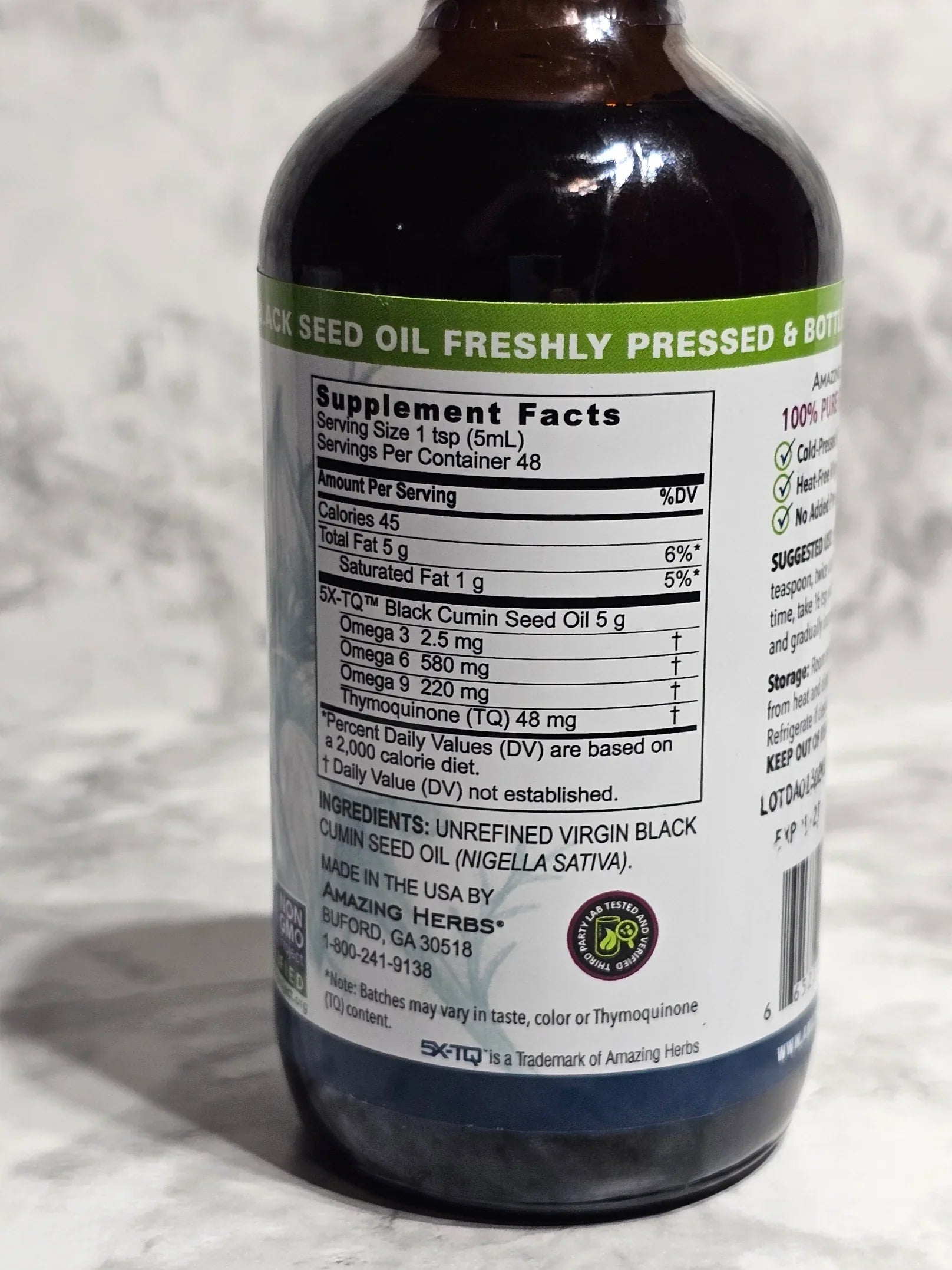 Bottle with a label showing supplement facts on a textured white background