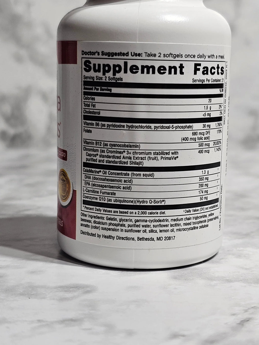 Supplement container with label on a marble surface