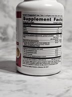 Supplement container with label on a marble surface