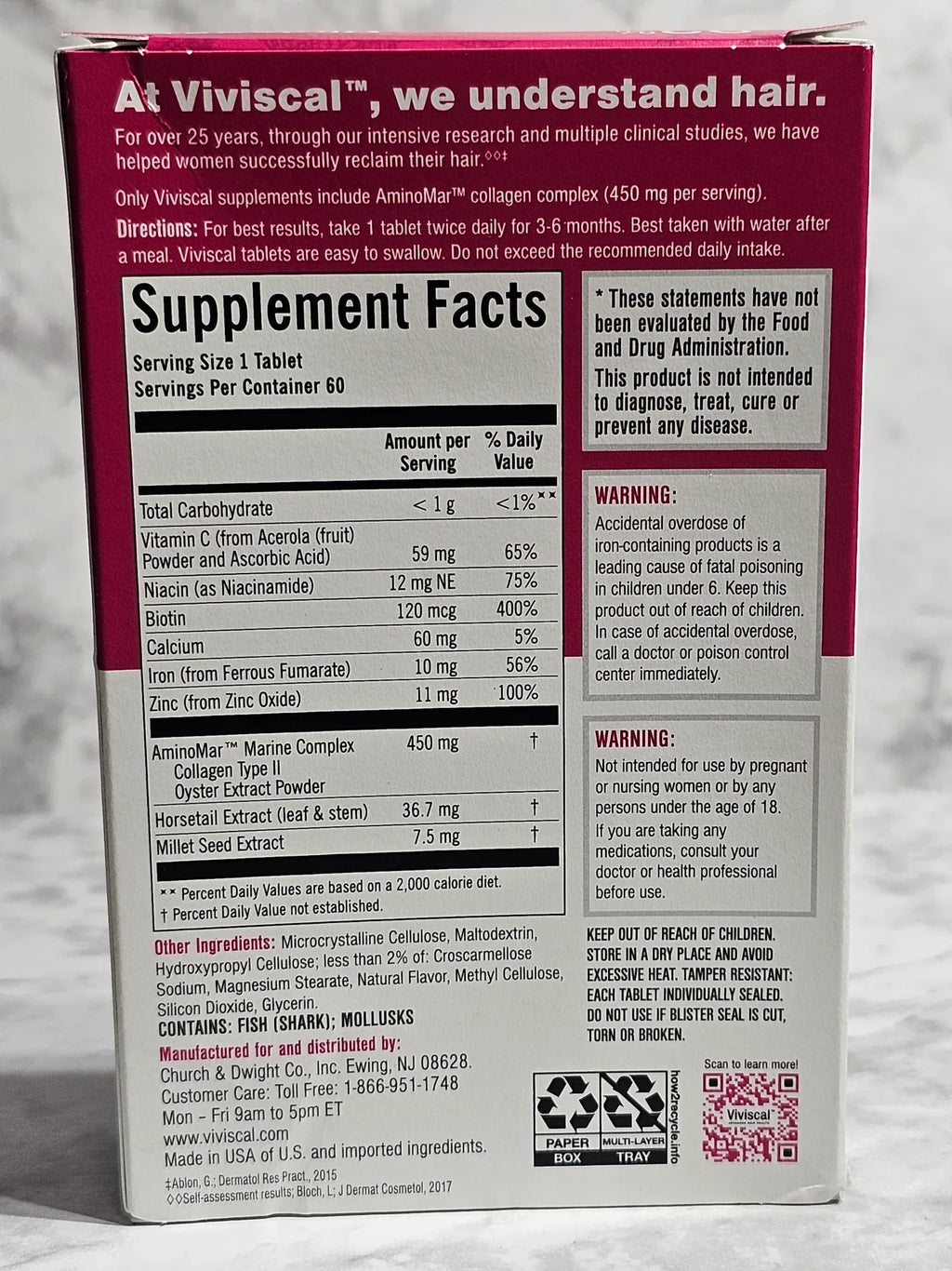 Supplement facts label on a red and white box with text and barcodes.