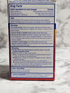 Medication box with label on a marble surface