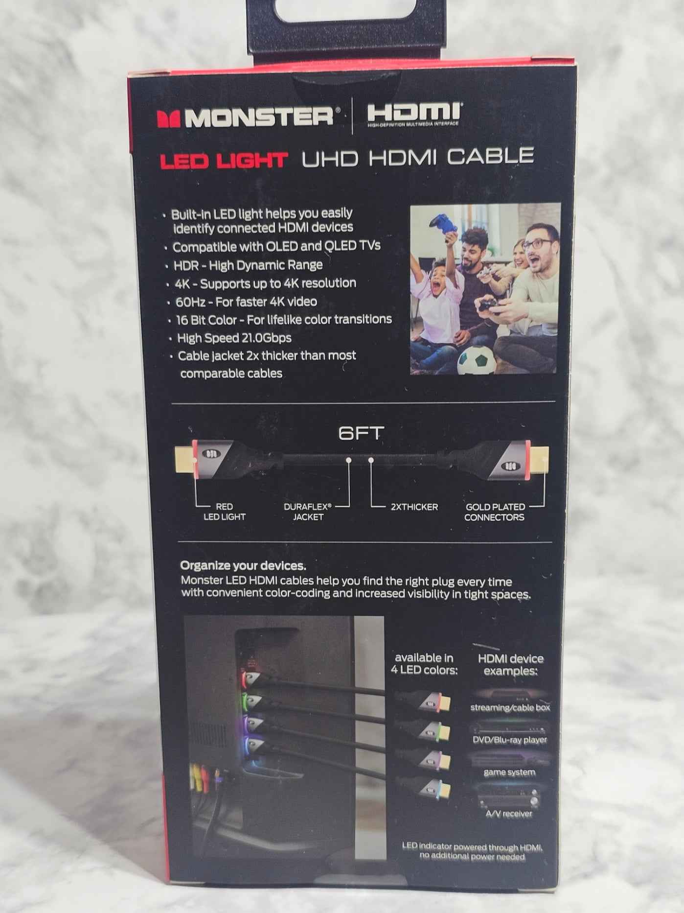 Monster LED Light UHD HDMI cable packaging on a textured surface