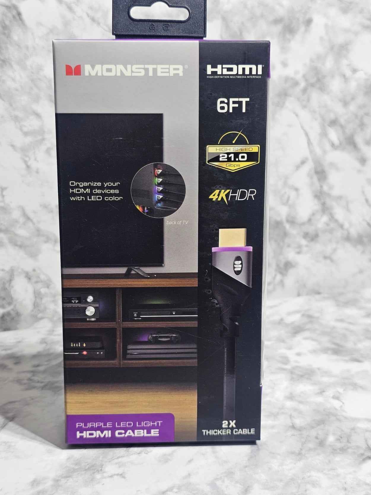 Monster HDMI cable packaging on a marble surface