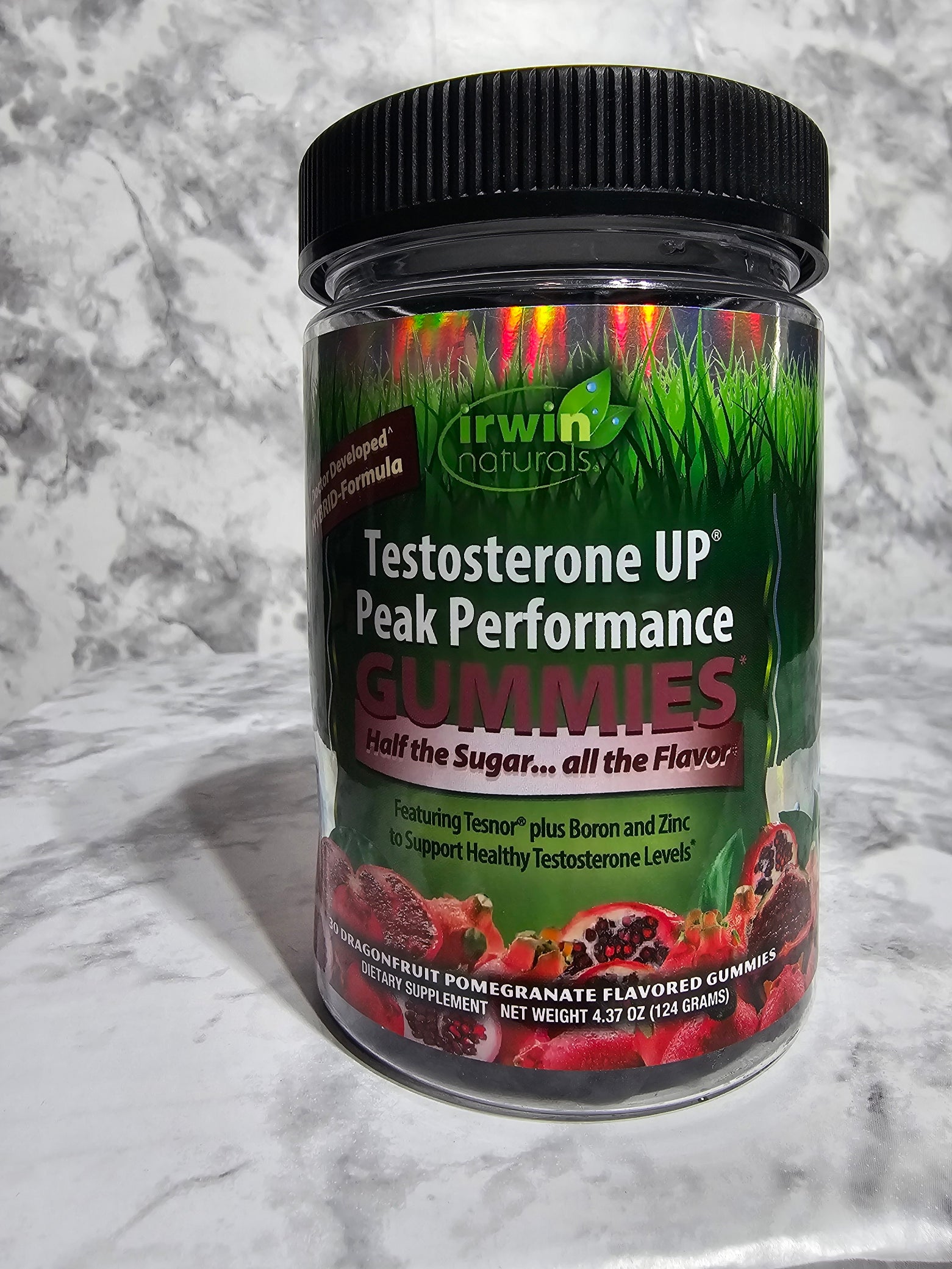 Supplement container labeled 'Testosterone Up' on a marble surface