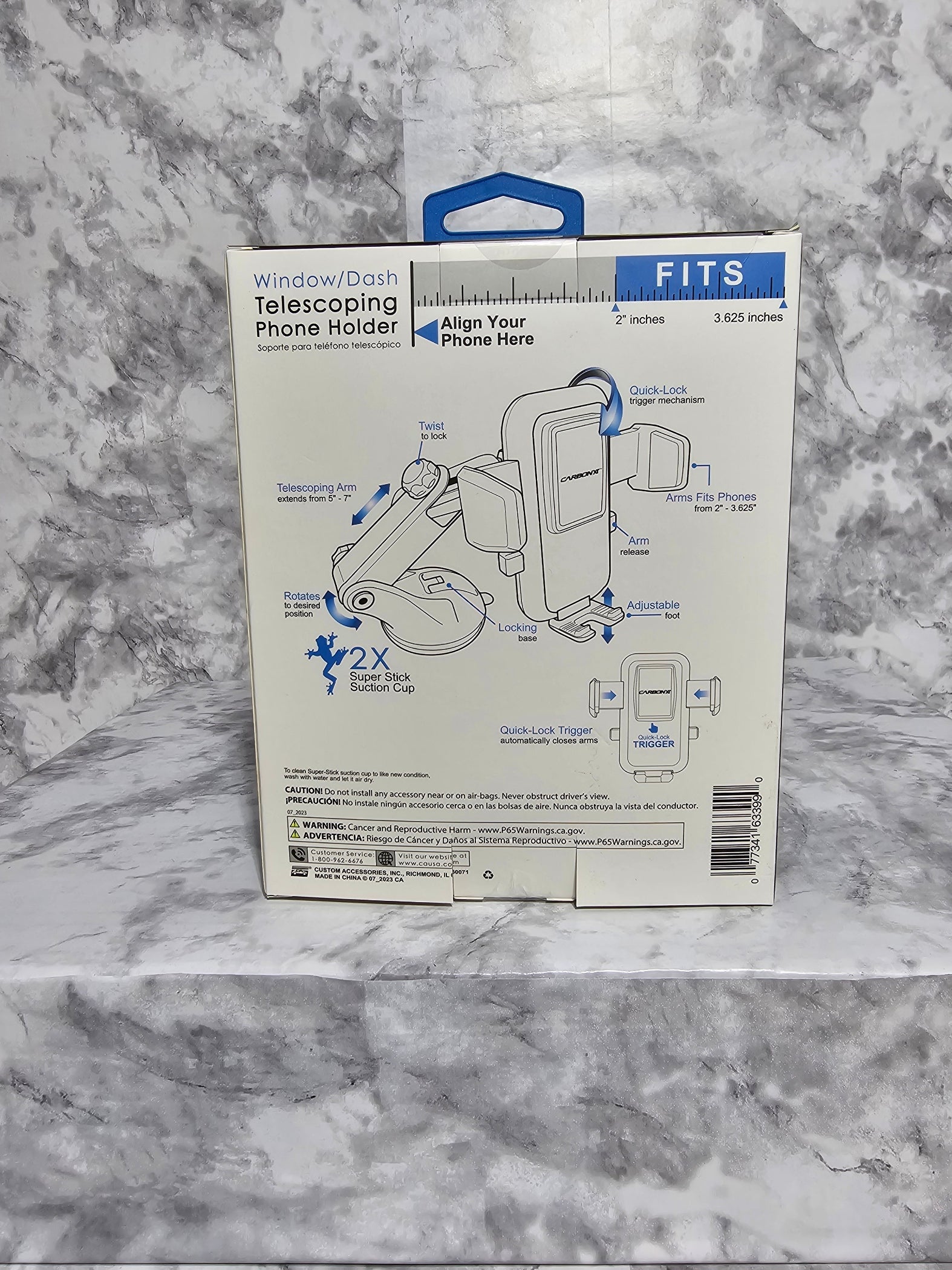 Product packaging for a window phone holder on a marble surface