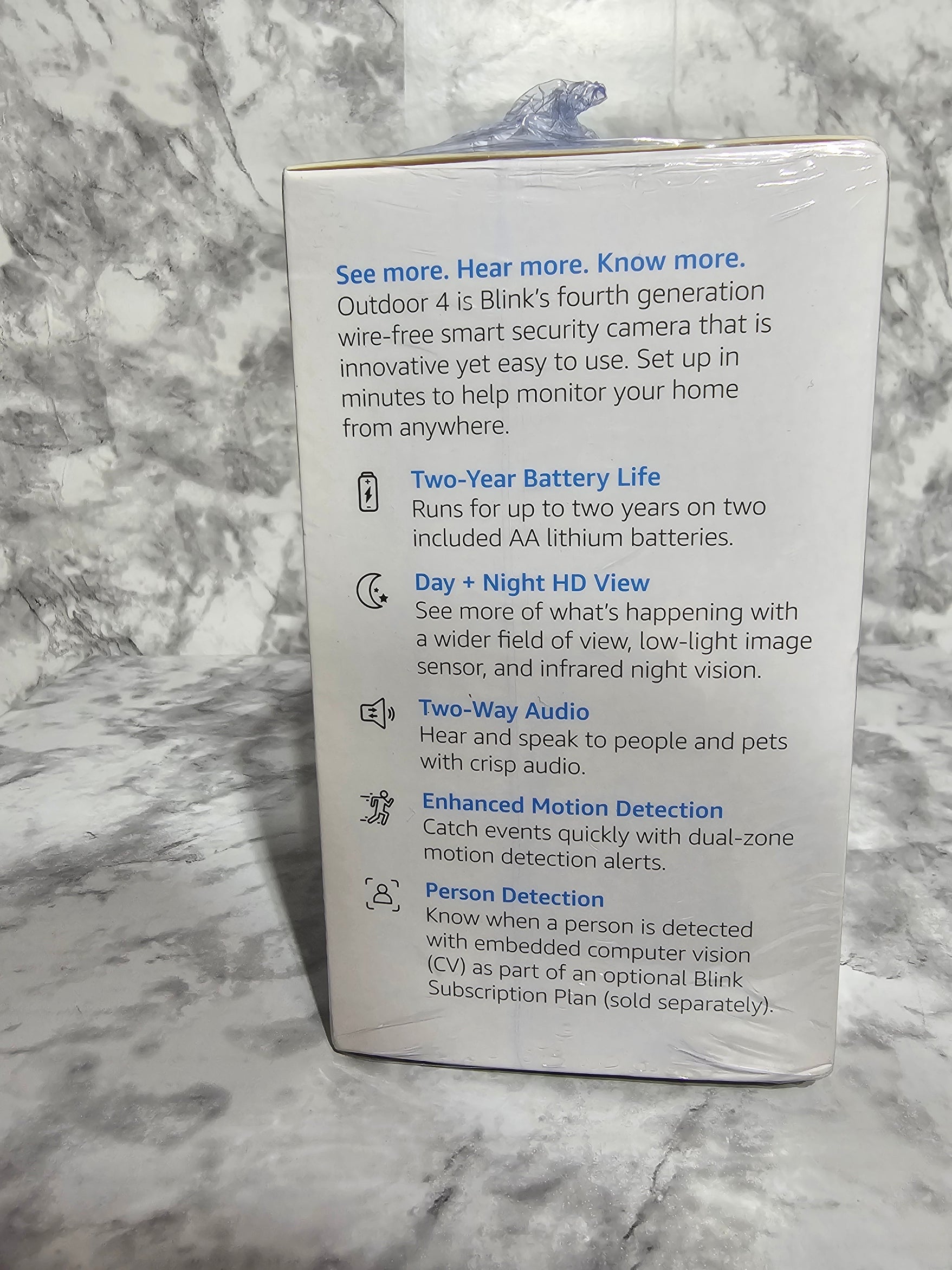 Product packaging with text on a marble surface