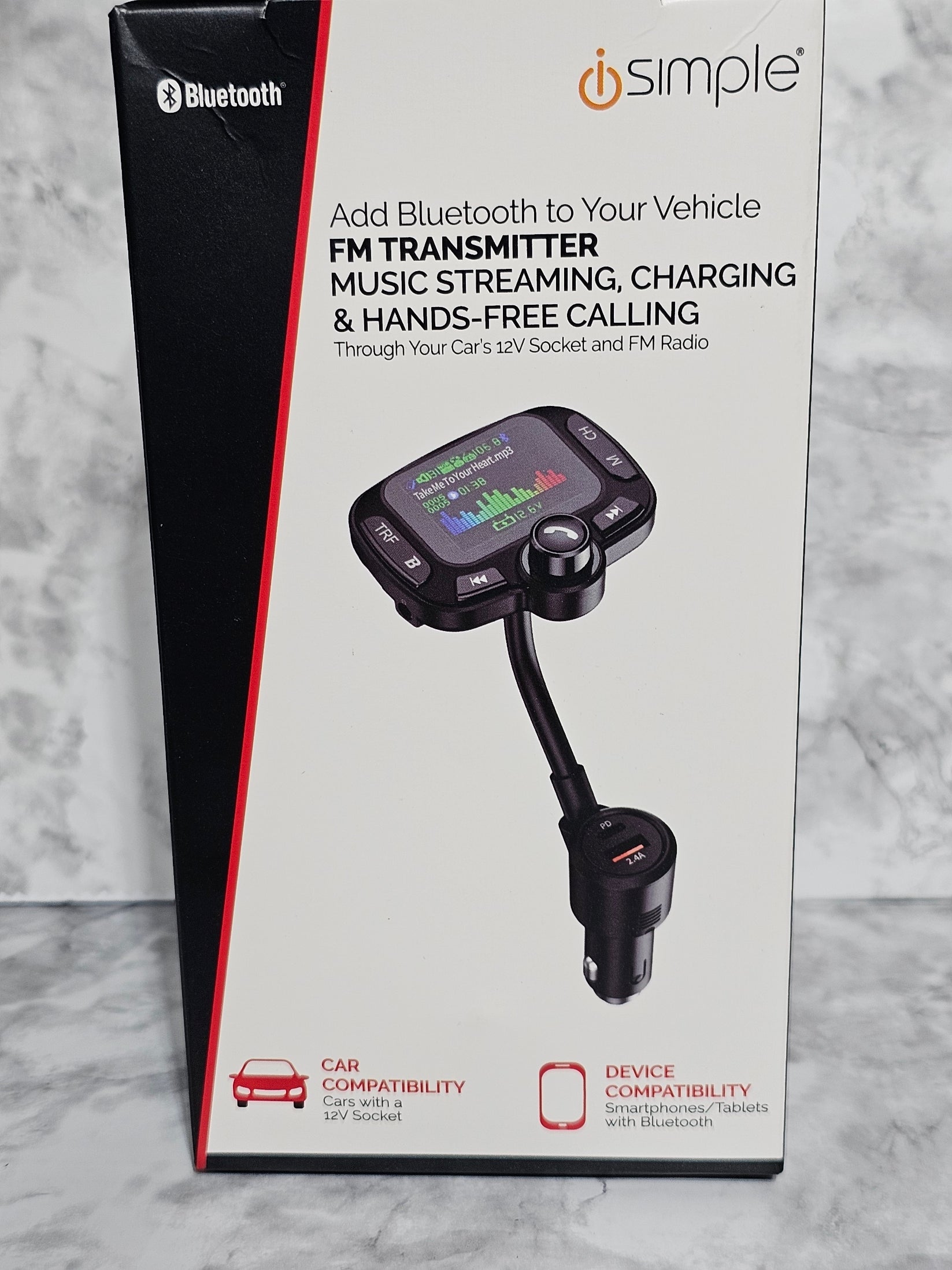 iSimple car Bluetooth transmitter on a gray marble surface