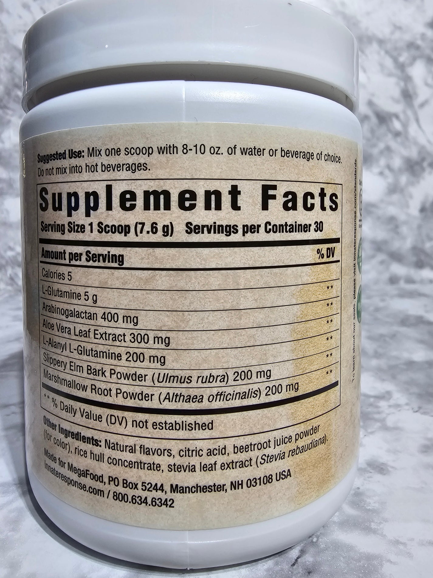 Supplement container with label on a marble surface