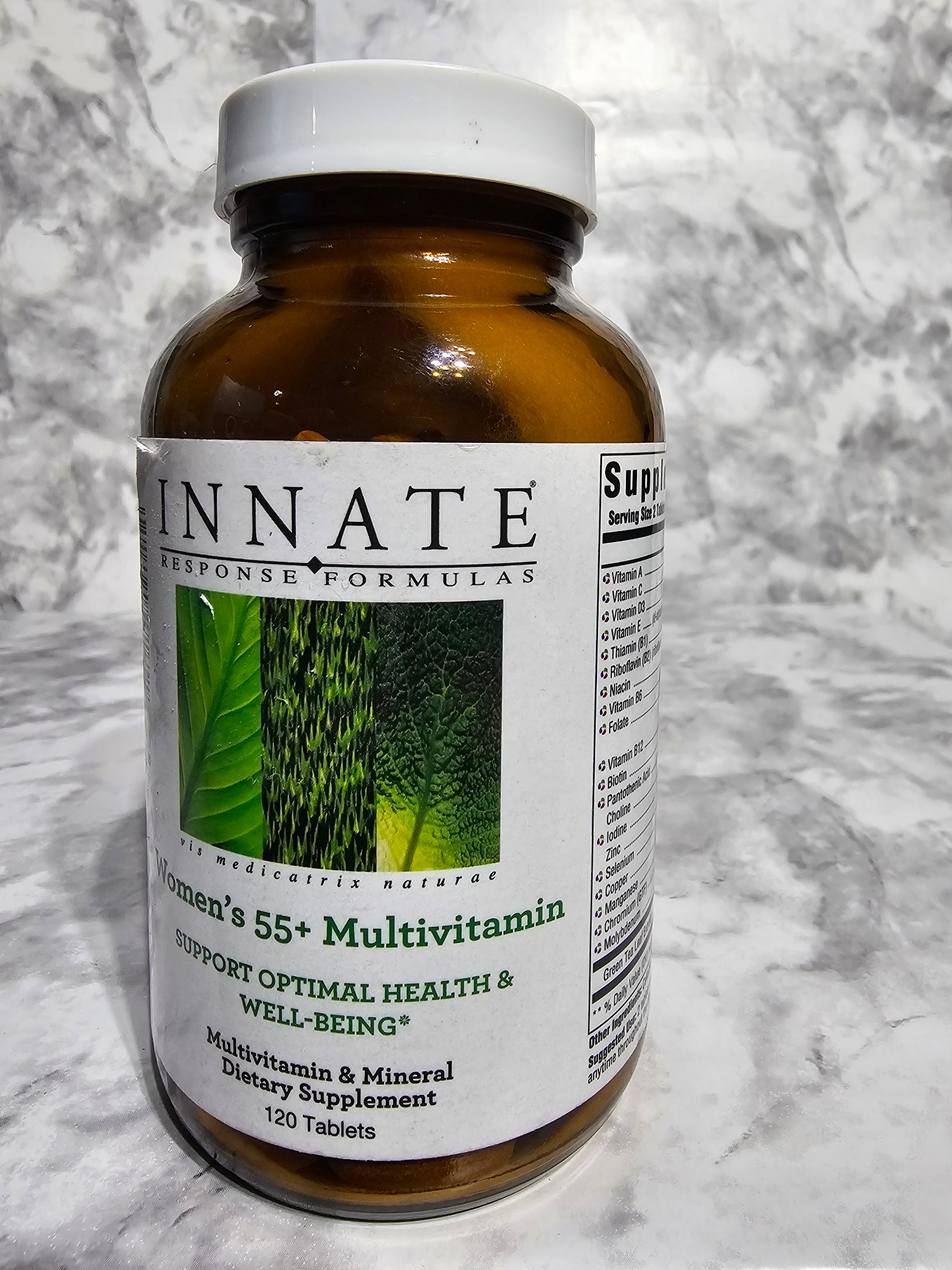 Supplement bottle with label on a marble surface