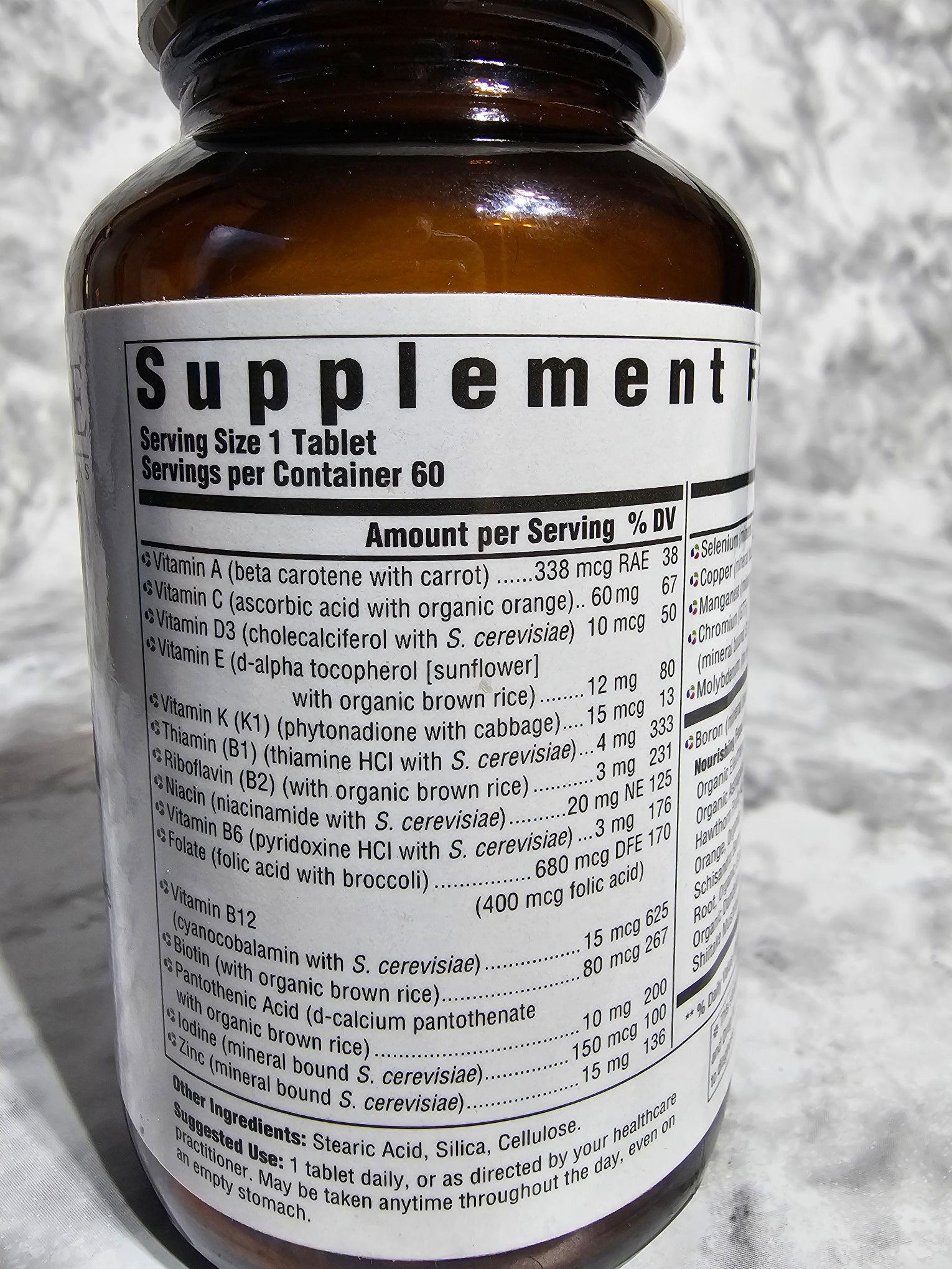 Supplement bottle with label on a textured surface