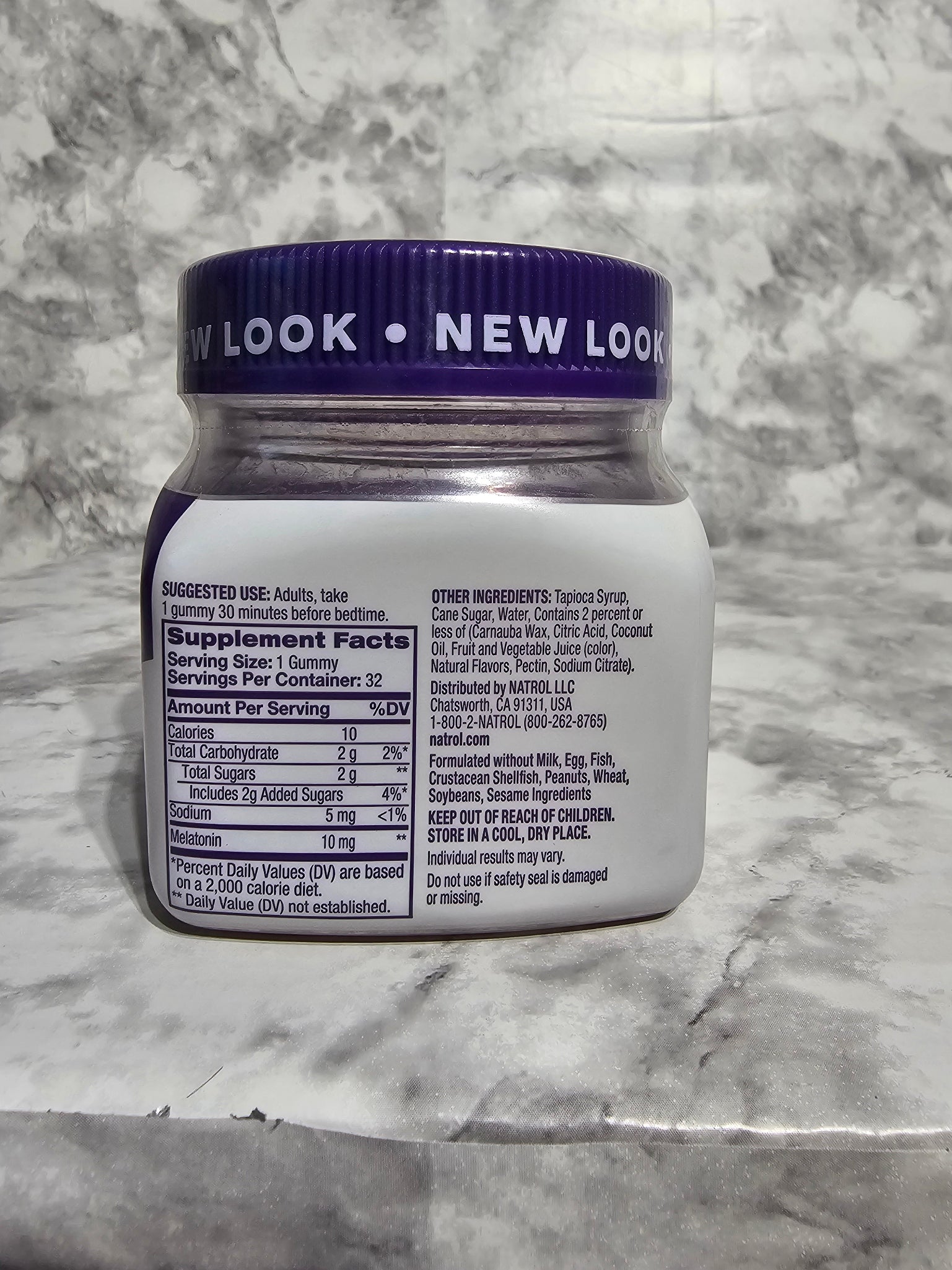 Bottle cap with label on a marble surface