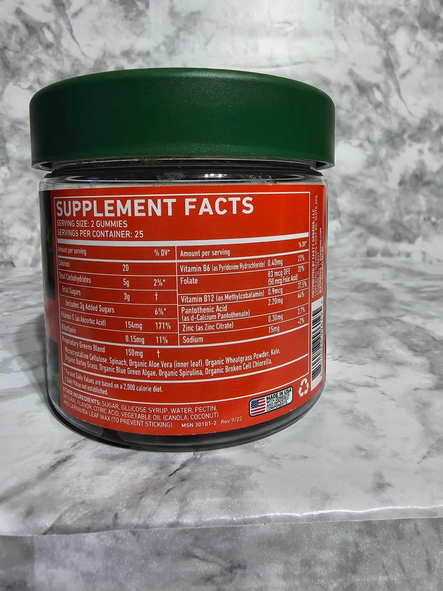 Supplement container with label on a marble surface