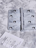 Close-up of the Baldwin chrome hinge with staggered holes and button tips