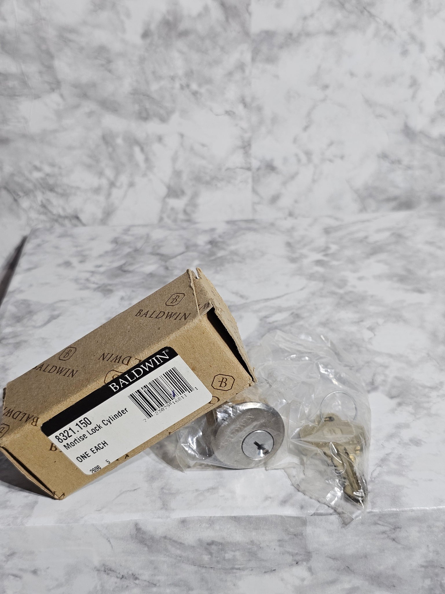 Cardboard box with a label on a marble surface