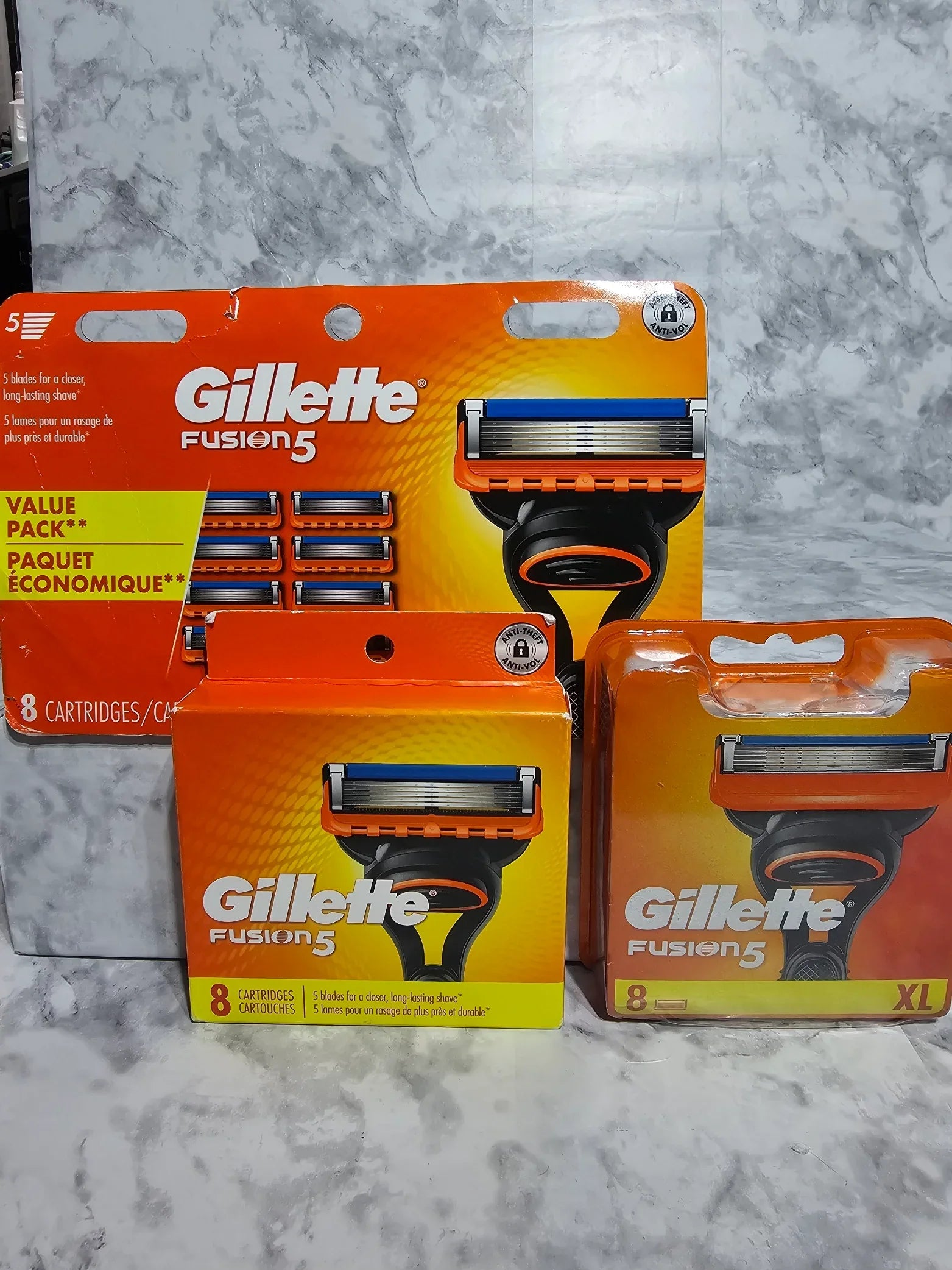 Gillette Fusion razor and cartridge packaging on a marble surface
