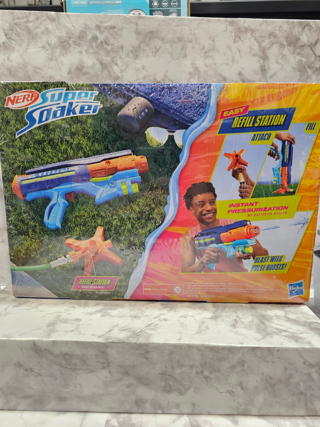 Nerf gun packaging on a marble surface