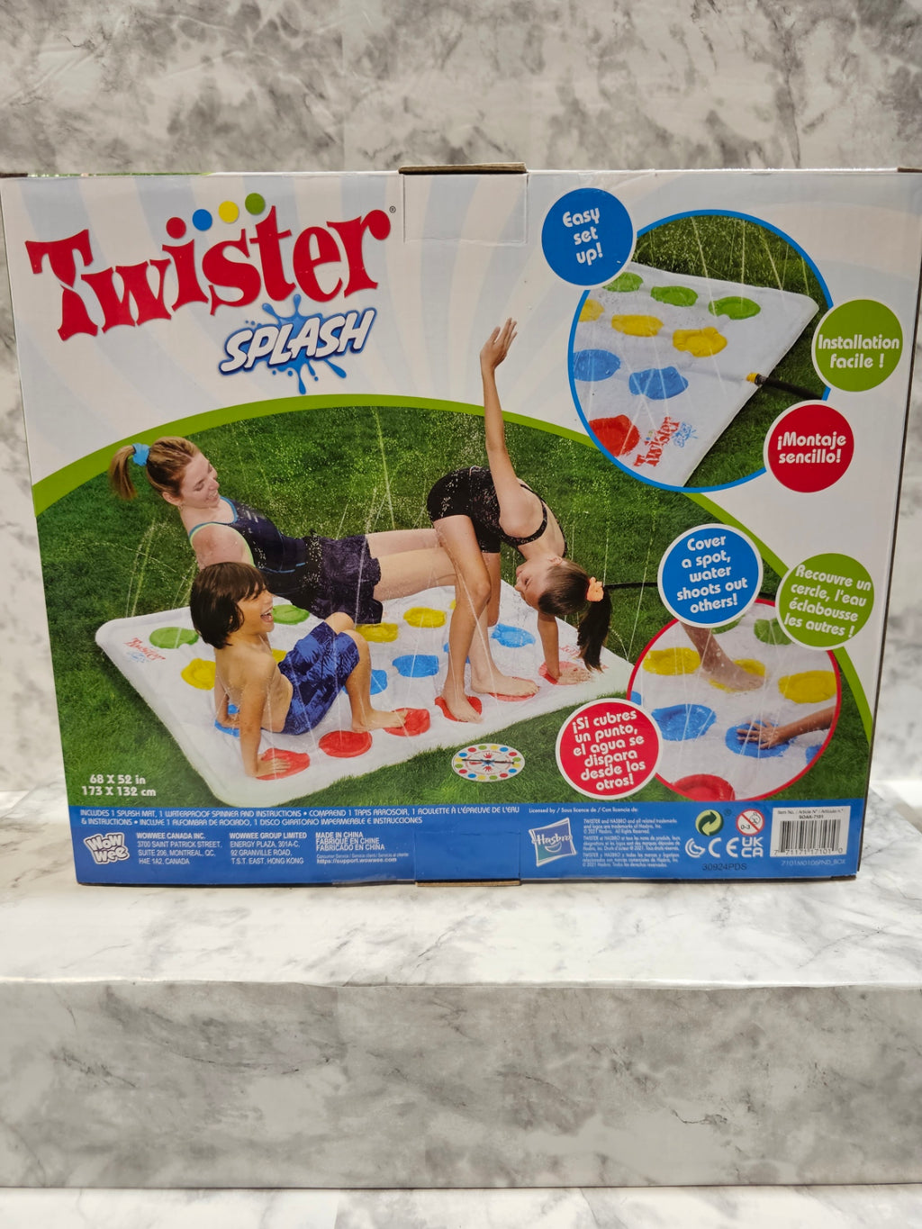 Twister Splash game box on a marble surface