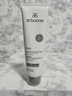 Arbonne Clarifying Detox Mask with Exfoliating Charcoal 5 oz tube on marble surface - More4less Outlet