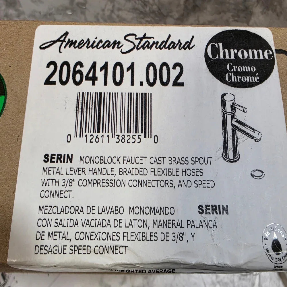 American Standard faucet label with product details and barcode on a cardboard box.