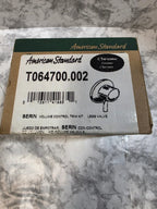 American Standard plumbing fixture packaging on a marble surface