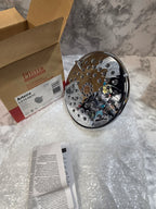 Mechanical component on a marble surface with packaging materials around